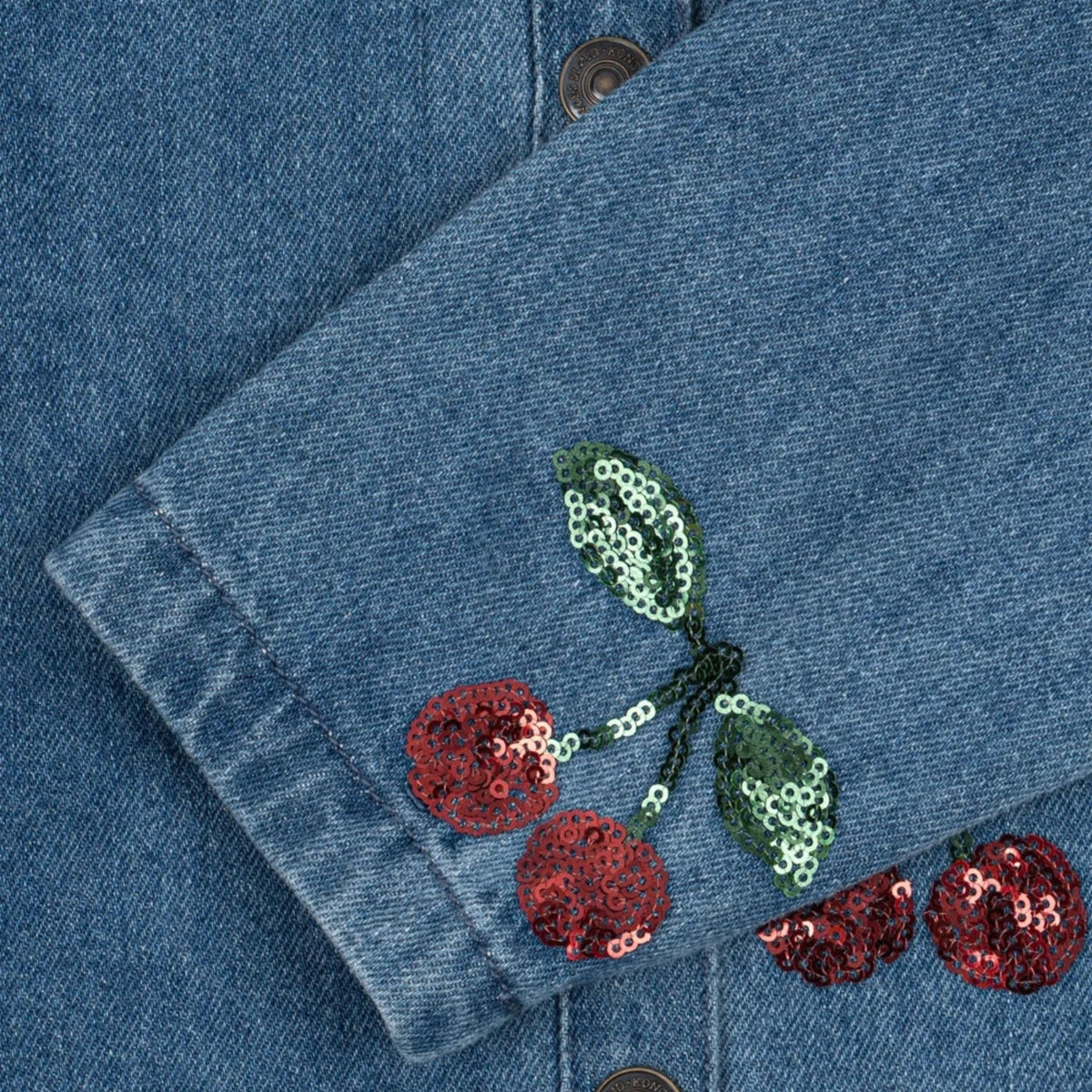Βρεφικό denim jacket με παγιέτες κερασάκια Magot Sequin Konges Slojd